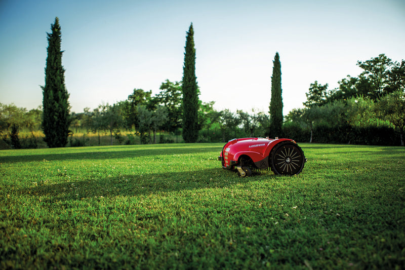 L250 Deluxe Ambrogio Robotic Lawn Mower cutting lawn on grass